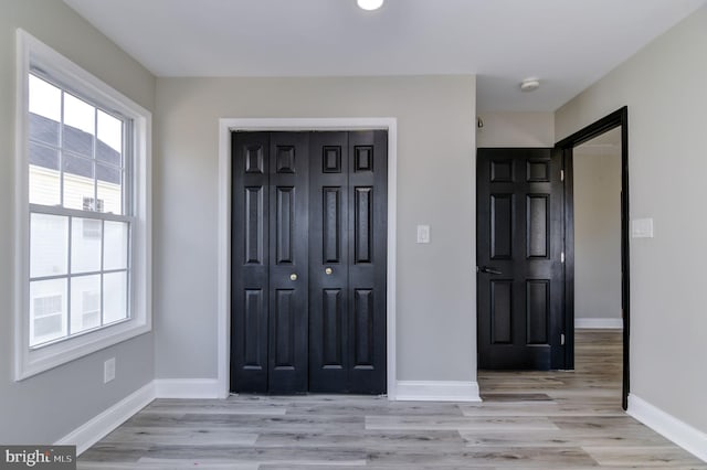 entrance foyer featuring light wood-type flooring