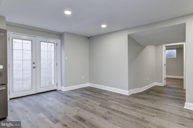 interior space featuring french doors and light hardwood / wood-style floors