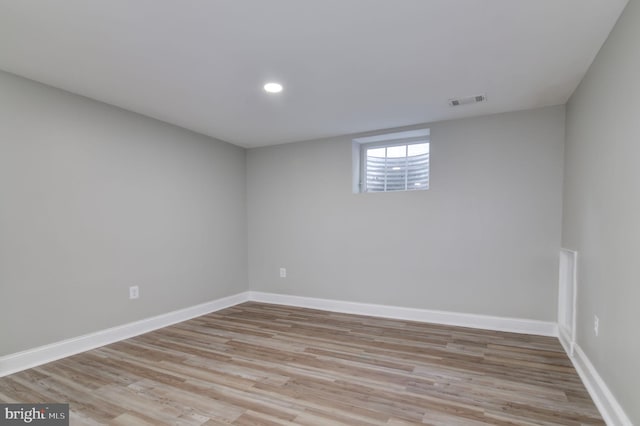 spare room featuring light hardwood / wood-style floors