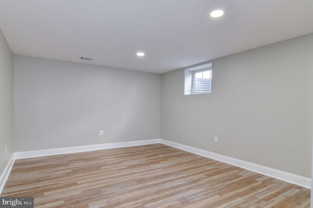 unfurnished room with light hardwood / wood-style floors