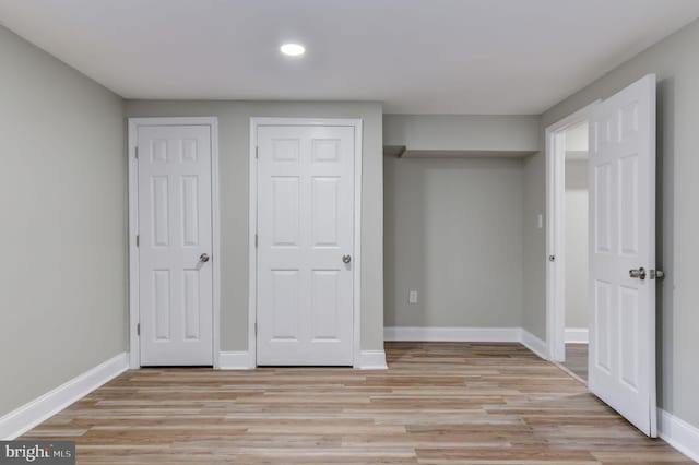 unfurnished bedroom with light hardwood / wood-style flooring