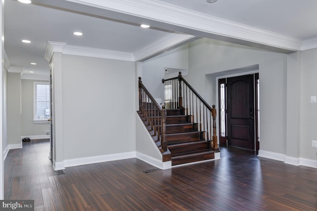 entryway featuring crown molding and dark hardwood / wood-style flooring