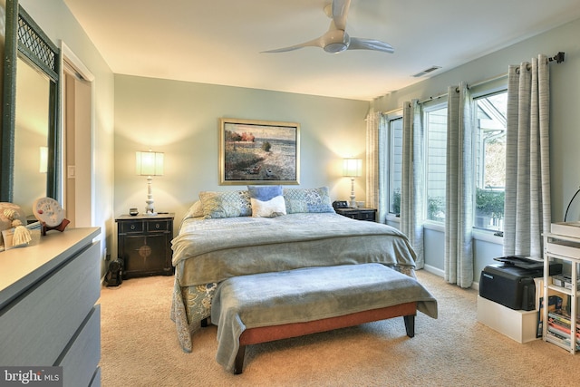 bedroom featuring ceiling fan and light colored carpet