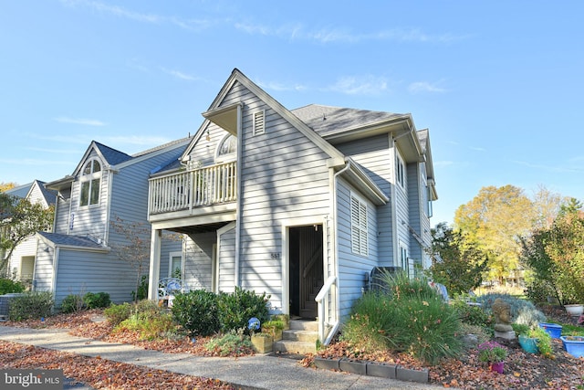 view of front of home featuring a balcony