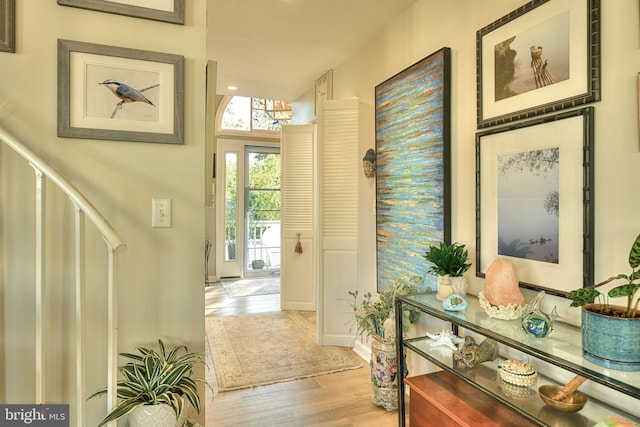 foyer entrance with light hardwood / wood-style floors