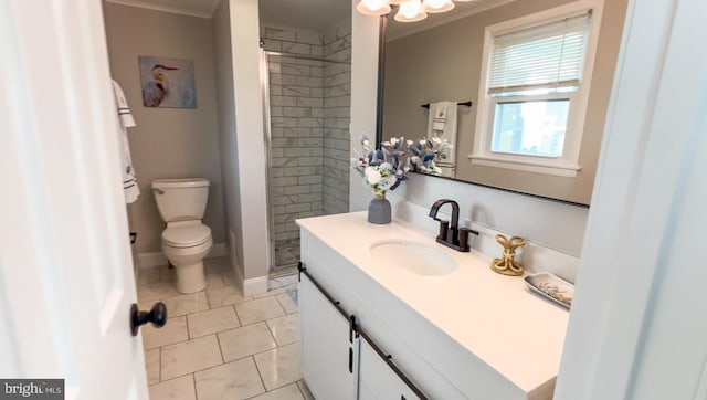 bathroom featuring vanity, tiled shower, and toilet