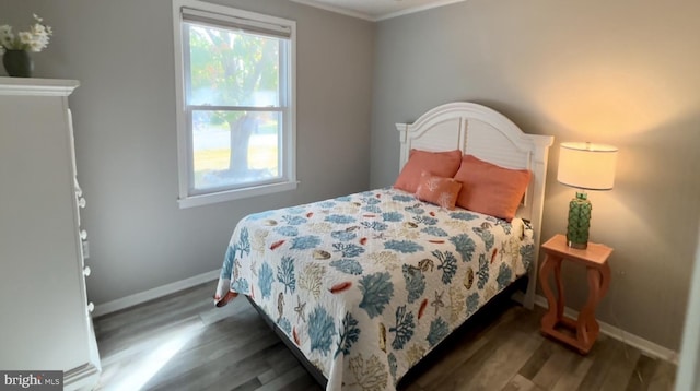 bedroom with dark wood-type flooring