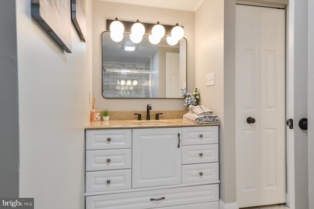 bathroom featuring vanity, a shower, and ornamental molding