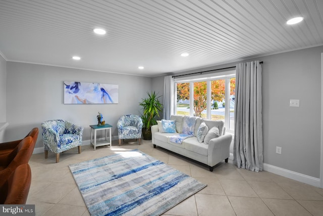 living room with ornamental molding and light tile patterned floors