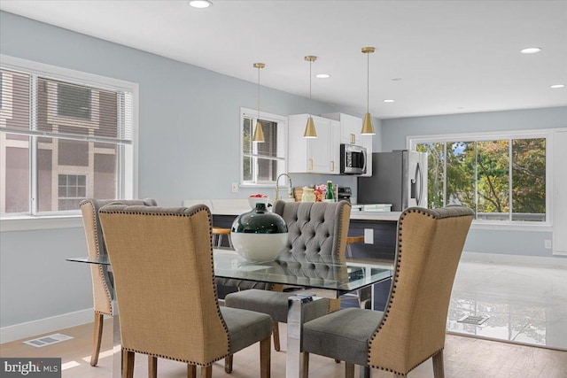 dining room featuring light hardwood / wood-style flooring