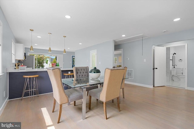 dining space featuring light hardwood / wood-style floors