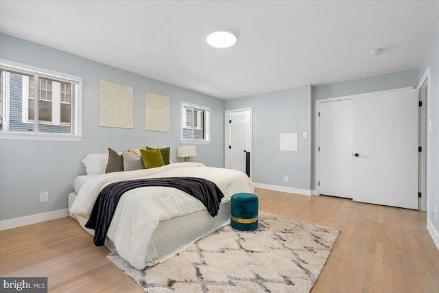 bedroom with light wood-type flooring