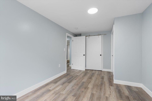 unfurnished bedroom with light wood-type flooring