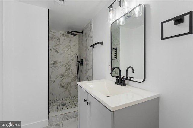 bathroom featuring vanity and tiled shower