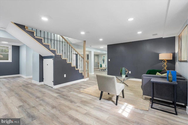 living room with light hardwood / wood-style floors