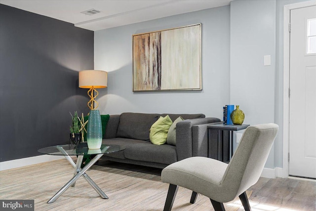 living room with light hardwood / wood-style flooring