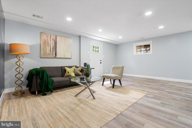 living room with light hardwood / wood-style floors