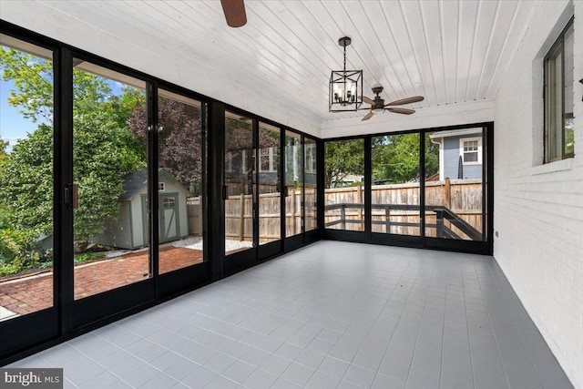 unfurnished sunroom featuring wood ceiling and a notable chandelier