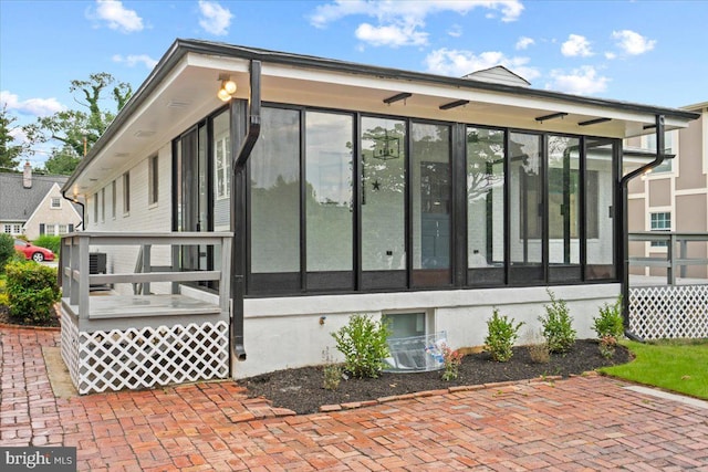 view of home's exterior featuring a sunroom