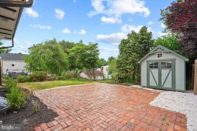 view of patio / terrace featuring a storage shed