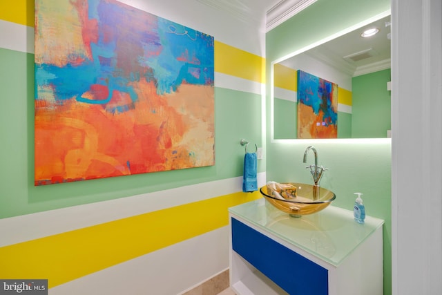 bathroom featuring vanity and crown molding