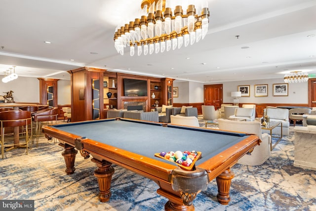 rec room featuring billiards, wood walls, carpet flooring, ornamental molding, and bar area