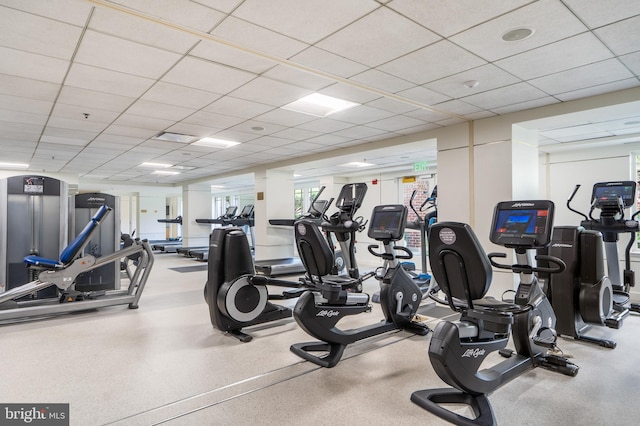 workout area featuring a drop ceiling