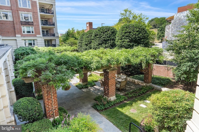 surrounding community with a patio area