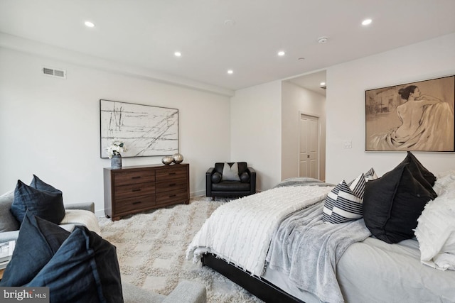 bedroom featuring light colored carpet