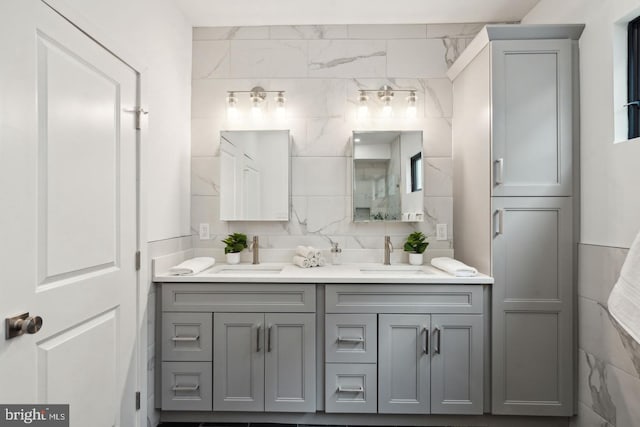 bathroom featuring vanity and backsplash