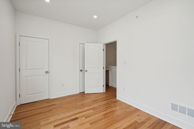 unfurnished bedroom with light hardwood / wood-style floors