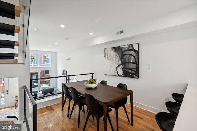 dining area with light hardwood / wood-style floors