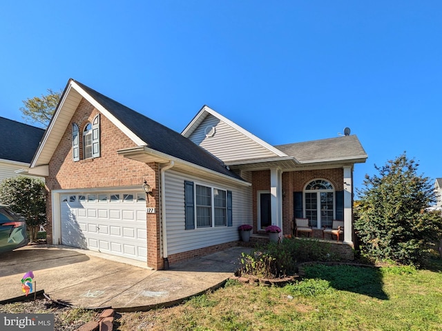 front of property featuring a front yard and a garage