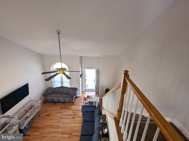 living room featuring light wood-type flooring and ceiling fan