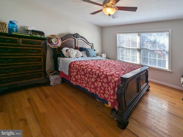 bedroom featuring ceiling fan and light hardwood / wood-style flooring