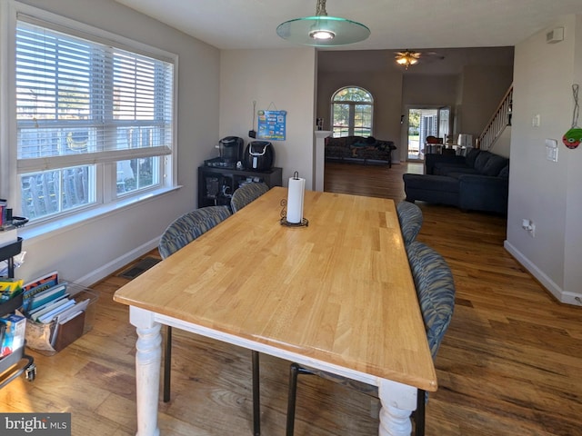 dining area with hardwood / wood-style floors