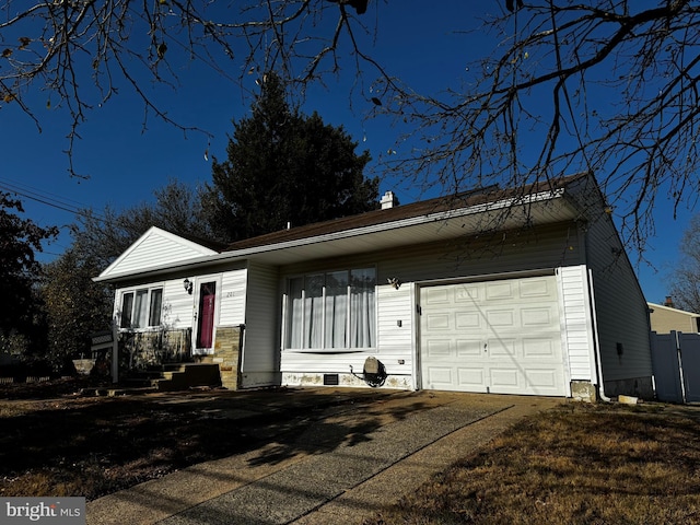 ranch-style home featuring a garage