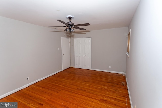 unfurnished room with wood-type flooring and ceiling fan