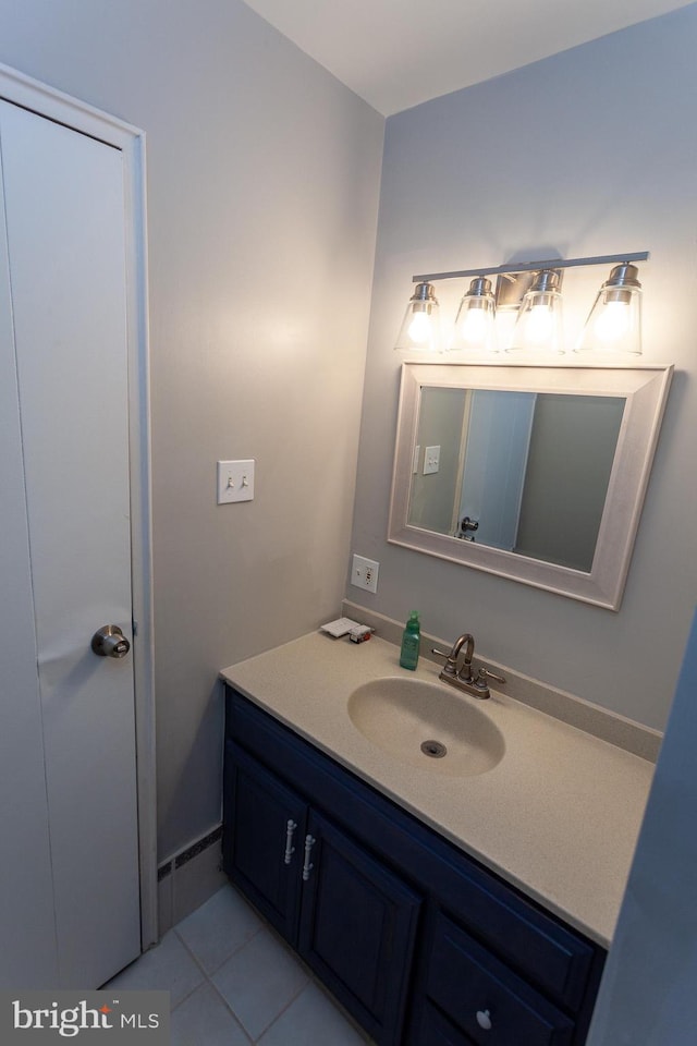 bathroom with tile patterned flooring and vanity