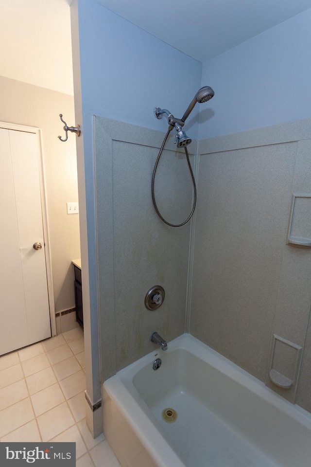 bathroom featuring tile patterned floors, vanity, and shower / washtub combination