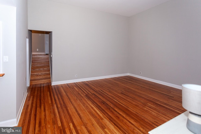 spare room with hardwood / wood-style floors