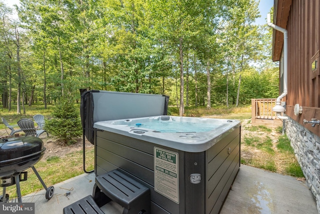 view of patio featuring area for grilling and a hot tub