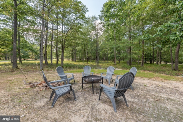 view of patio with a fire pit