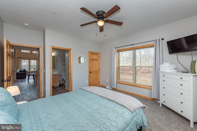 bedroom featuring connected bathroom, carpet flooring, and ceiling fan