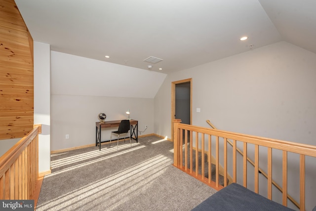 bonus room featuring wood walls, lofted ceiling, and carpet floors