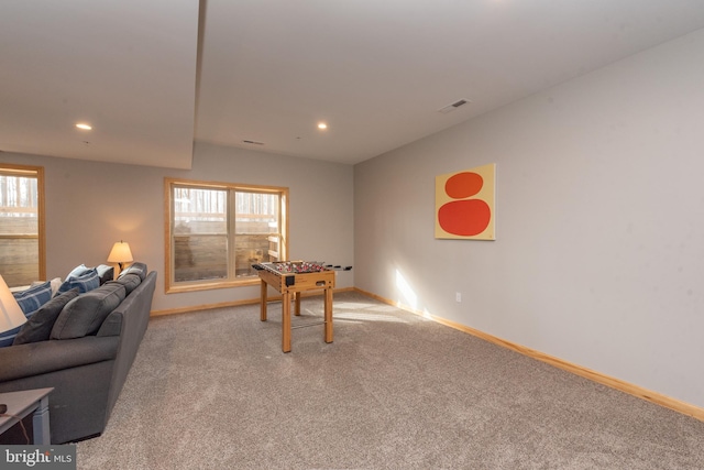 rec room featuring light colored carpet