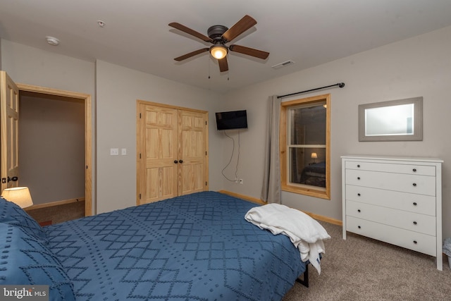 carpeted bedroom with ceiling fan