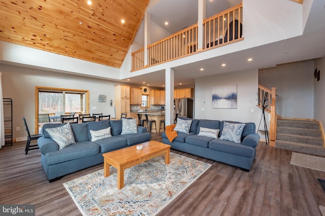 living room with high vaulted ceiling and hardwood / wood-style flooring