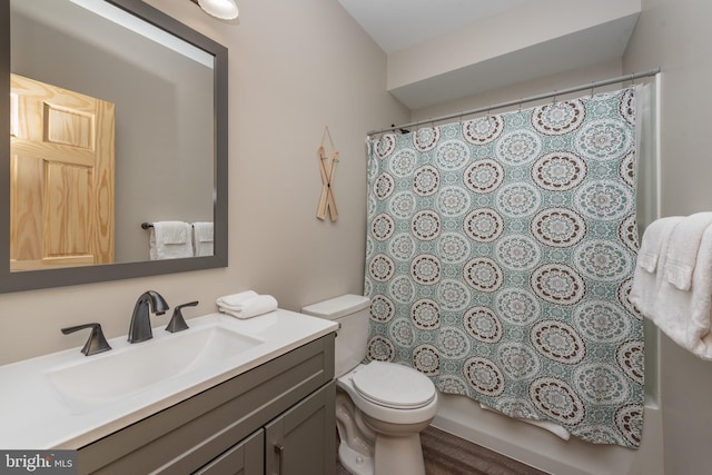 full bathroom with toilet, vanity, wood-type flooring, and shower / bathtub combination with curtain