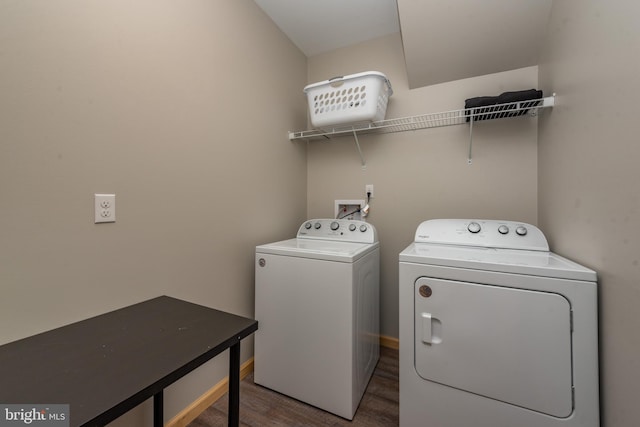 clothes washing area with washing machine and dryer and hardwood / wood-style flooring